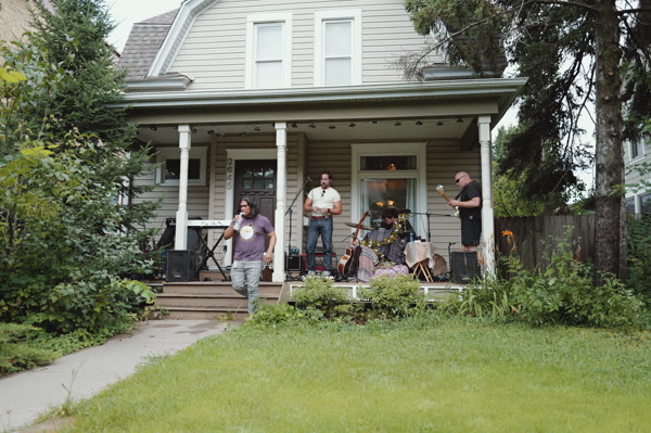Full band on the porch — establishing shot